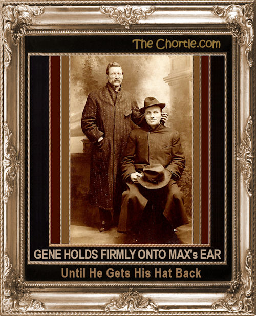 Gene holds firmly onto Max's ear until he gets his hat back.